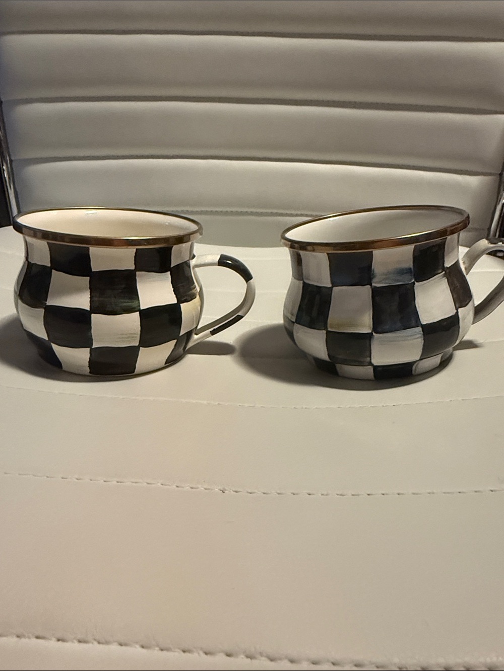 Two MacKenzie-Childs Black and White Checkered Mugs with Gold Trim
